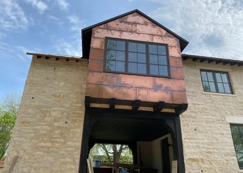Copper metal panel facade on a stone building for Skylight Installation in Lake Wylie