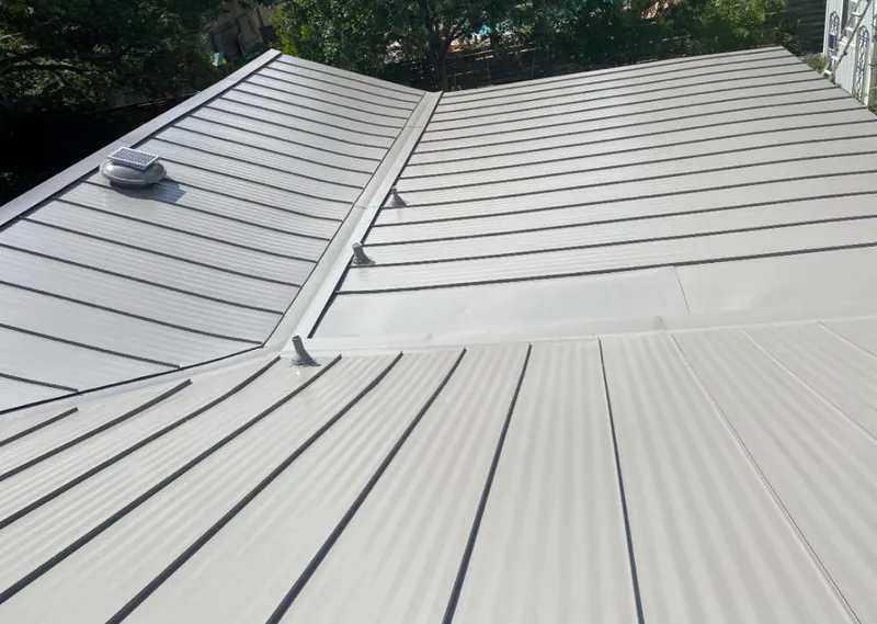 Solar attic fan installed on a metal roof for Roof Ventilation in Lake Wylie